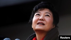 FILE - South Korea's presidential candidate Park Geun-hye of the ruling Saenuri Party attends her election campaign rally in Suwon, about 46 km (29 miles) south of Seoul, Dec. 17, 2012.