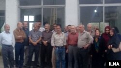 Workers at the Iran Poplin textile plant in Rasht, Iran, gather on May 21, 2018, to protest the factory management's removal of machines they need to do their jobs.