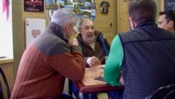 Maranchon Mayor Jose Luis Sastre (C) says residents have switched from being skeptical about the wind farm surrounding them to happy about the income it brings in. (Lisa Bryant/VOA)