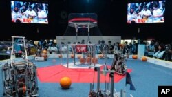 A team from Korea, on the right, competes with UAE Falcons during the First Global Challenge, a robotics and artificial intelligence competition in Dubai, United Arab Emirates, Oct. 25, 2019 photo.