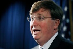 Republican Gov. Tate Reeves addresses reporters during a news conference, March 4, 2020, in Jackson, Miss.