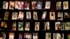 FILE - Family photographs of some of those who died hang in a display in the Kigali Genocide Memorial Centre in Kigali, Rwanda, April 2014. Officials said Rwandan Ladislas Ntaganzwa was arrested by Interpol agents in Congo, Dec. 7, 2015.