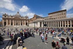 Faithful gather to listen to Pope Francis reciting the Angelus noon prayer from the window of his studio overlooking St.Peter's Square, at the Vatican, June 7, 2020.