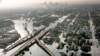 FILE - Floodwaters from Hurricane Katrina fill the streets near downtown New Orleans, Aug. 30, 2005.