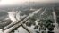 FILE - Floodwaters from Hurricane Katrina fill the streets near downtown New Orleans, Aug. 30, 2005.