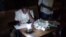 A Malian poll worker counts ballots in Bamako Aug. 11, 2013.