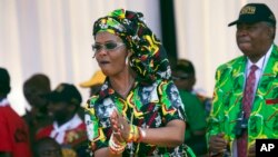 FILE - Grace Mugabe, then Zimbabwe's first lady, dances at a rally in Gweru, Zimbabwe, Sept, 1, 2017. 