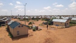 FILE - A man walks along a path in the Hamdallaye refugee camp amid the COVID-19 pandemic in Niger, July 29, 2020. (UNHCR/Selim Meddeb/Handout via Reuters)