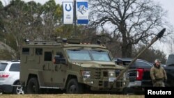 An armored law enforcement vehicle is seen in the area where a man has reportedly taken people hostage at a synagogue during services that were being streamed live, in Colleyville, Texas, Jan. 15, 2022. 