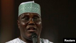FILE - Former Nigerian Vice-President and presidential aspirant Atiku Abubakar speaks to delegates during the presidential primaries of the ruling People's Democratic Party in Abuja on January 13, 2011.