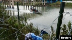 Border Patrol officers patrol the Rio Grande river on an airboat, as U.S. border cities brace for an influx of asylum seekers as COVID-era Title 42 migration restrictions are set to end, in Eagle Pass, Texas, Dec. 19, 2022. 