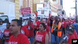 FILE - Union members picket outside the Trump Taj Mahal caino in Atlantic City, N.J. 