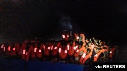 FILE - Migrants wait to be rescued by the Ocean Viking during a search and rescue operation in the Mediterranean Sea, July 5, 2021. (Flavio Gasperini/SOS Mediterranee/Handout via Reuters)