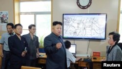 FILE - North Korean leader Kim Jong Un gives field guidance to the Hydro-meteorological Service.