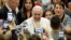 Pope Francis arrives for an audience with Vatican employees, in the Pope Paul VI hall, at the Vatican, Friday, Dec. 21, 2018. 