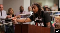FILE - Muhiyidin d'Baha, whose legal name was Muhiyidin Elamin Moye, speaks during a meeting with North Charleston city council in North Charleston, S.C., April 9, 2015. 