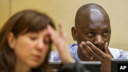 Congolese warlord Thomas Lubanga is seen at his appeals hearing at the International Criminal Court in The Hague, Dec. 1, 2014.