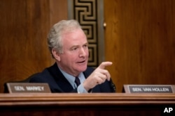 FILE - Sen. Chris Van Hollen, D-Md., questions a witness on Capitol Hill in Washington, Jan. 16, 2019.