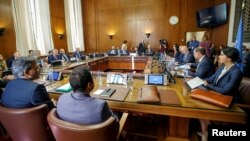 Iran's Deputy Foreign Minister Hossein Jaberi Ansari, Russia's special envoy on Syria Alexander Lavrentiev, Turkish Deputy Foreign Minister Sedat Onal, and U.N. Special Envoy for Syria Staffan de Mistura attend a meeting on Syria in Geneva, Switzerland, Sept. 11, 2018.