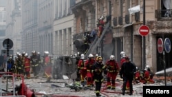 Firemen work at the site of an explosion in a bakery shop in the 9th District in Paris, Jan. 12, 2019.