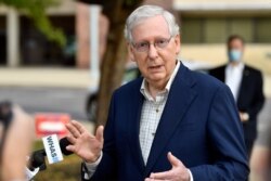 Senate Majority Leader Mitch McConnell, R-Ky., speaks to reporters after casting his vote in the 2020 general election at the Kentucky Exhibition Center in Louisville, Ky., Oct. 15, 2020.