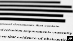 Pernyataan tertulis FBI yang mendukung untuk mendapatkan surat perintah penggeledahan untuk perkebunan Mar-a-Lago mantan Presiden Donald Trump, Jumat, 26 Agustus 2022. (Foto: AP)