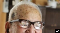 Jirouemon Kimura, of Japan, smiles on his 114th birthday in April 2011. A new study finds happy people tend to live longer.