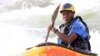 David Egesa, 40, a member of Uganda's kayaking team, paddles against waves during a team practice session in the River Nile in Jinja, east of Uganda's capital, Kampala, Aug. 19, 2015.