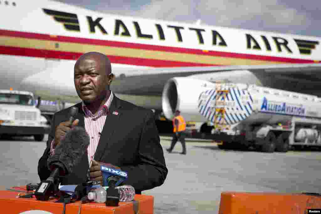 Augustine Ngafuan, Minister of Foreign Affairs of Liberia, speaks to the media as a 747 aircraft is loaded with supplies, including 100 tons of emergency medical aid, at New York's John F. Kennedy International Airport, Sept. 20, 2014.