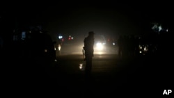 Afghan security forces patrol the site of an attack on an Afghan parliament member's house in western Kabul, Afghanistan, Dec. 21, 2016.
