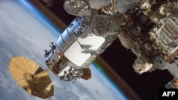 FILE - This NASA handout photo obtained April 5, 2021, shows the Cygnus resupply ship from Northrop Grumman, pictured March 28, 2021, attached to the International Space Station's Unity module.