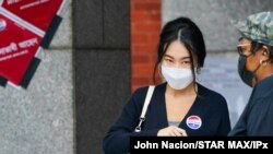 FILE - People wait in a line to vote during early voting for the U.S. Presidential election on Oct. 24, 2020 in New York City.