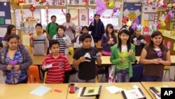In this photo taken on Tuesday, April 20, 2010, CedarLane Middle School students take a Chinese Language and Culture class in the Hacienda Heights area of Los Angeles. (AP Photo/Damian Dovarganes)