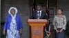 Kenya's Deputy President William Ruto (C) flanked by his wife Rachel Ruto (R) and mother Sarah Cherono (L) addresses a news conference on the ruling by the International Criminal Court (ICC) on the case against him and broadcaster Joshua Sang in Nairobi, 