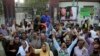 Supporters of former Pakistani Prime Minister Nawaz Sharif celebrate a court decision in favor of their leader, outside a hospital where he is receiving treatment, in Lahore, Pakistan, Oct. 29, 2019.
