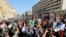 Demonstrators shout anti-terrorism slogans in front the site of a blast at Egyptian police headquarters in Cairo, Jan. 24, 2014.