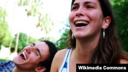 Two people laughing.