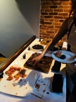 Columbia University hosted a reception for students and alumni based in D.C. at the Sonoma restaurant, July 11, 2019, where uncompensated interns in the area could snap up some pizza and brownies.