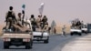 Syrian Democratic Forces (SDF) fighters head to Raqqa, Syria, June 6, 2017. 