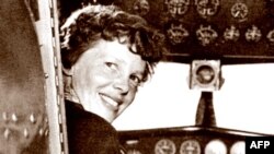 FILE - A May 20, 1937, photo shows US aviator Amelia Earhart at the controls of her Lockheed 10 Electra.