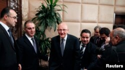 Lebanon's Prime Minister Tammam Salam (C) walks at the presidential palace in Baabda, near Beirut, Feb. 15, 2014. 