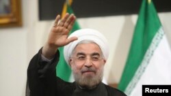 FILE - Iran's newly-elected President Hassan Rouhani is seen gesturing to the media during a news conference in Tehran, June 17, 2013.