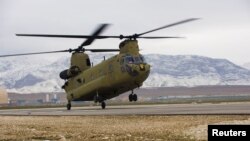 FILE - A U.S. CH-47F Chinook helicopter lands on the flight line after a maintenance test flight at Camp Marmal, in Mazar-e Sharif province, Afghanistan in this February 9, 2012 photo by the U.S. Army. 