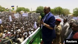 FILE - Sudanese President Omar Hassan al-Bashir addresses a crowd during a campaign rally in East Darfur, April 5, 2016. 