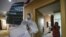 This photo taken on February 3, 2020 shows a doctor looking at a lung CT image while making his rounds at a ward of a quarantine zone in Wuhan, the epicentre of the new coronavirus outbreak, in China's central Hubei province. - The number of total infecti