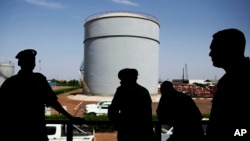 South Sudan security forces guard the Petrodar oil facility in Paloich in 2012. Neighboring Sudan sometimes blocks this landlocked country from oil export markets but a new Kenya pipeline may solve the problem.