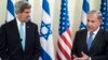 U.S. Secretary of State John Kerry listens as Israeli Prime Minister Benjamin Netanyahu makes a statement to the press before a meeting in Jerusalem on January 2, 2014. 