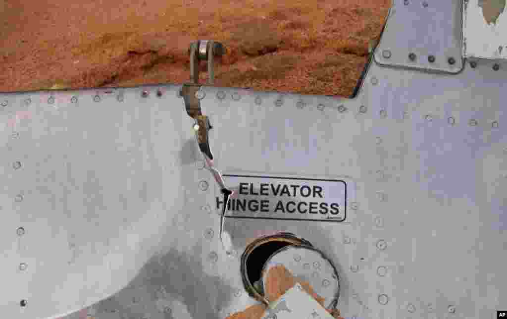 This photo provided by the Burkina Faso military shows a part of the Air Algerie plane at the crash site in Mali, July 25, 2014.