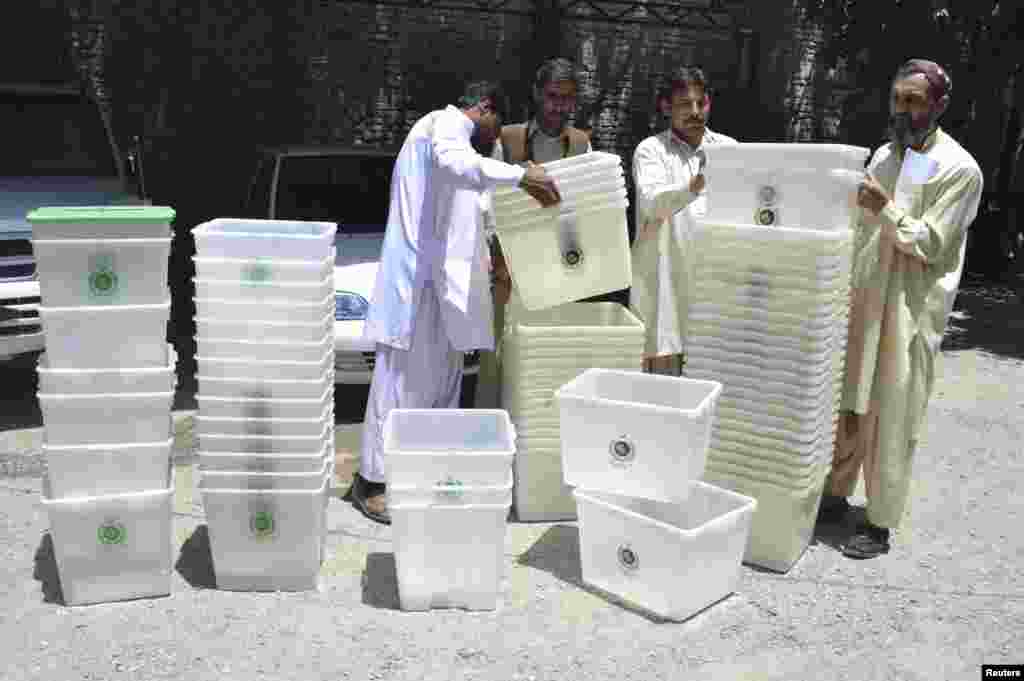 Election workers prepare ballot boxes at an election commission office in Quetta, Pakistan, May 8, 2013.