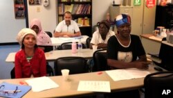 Syrian refugee Ahmad Alabood, rear, sits in the back row during English class at Della Lamb Community Services in Kansas City, Mo., June 13, 2016. 